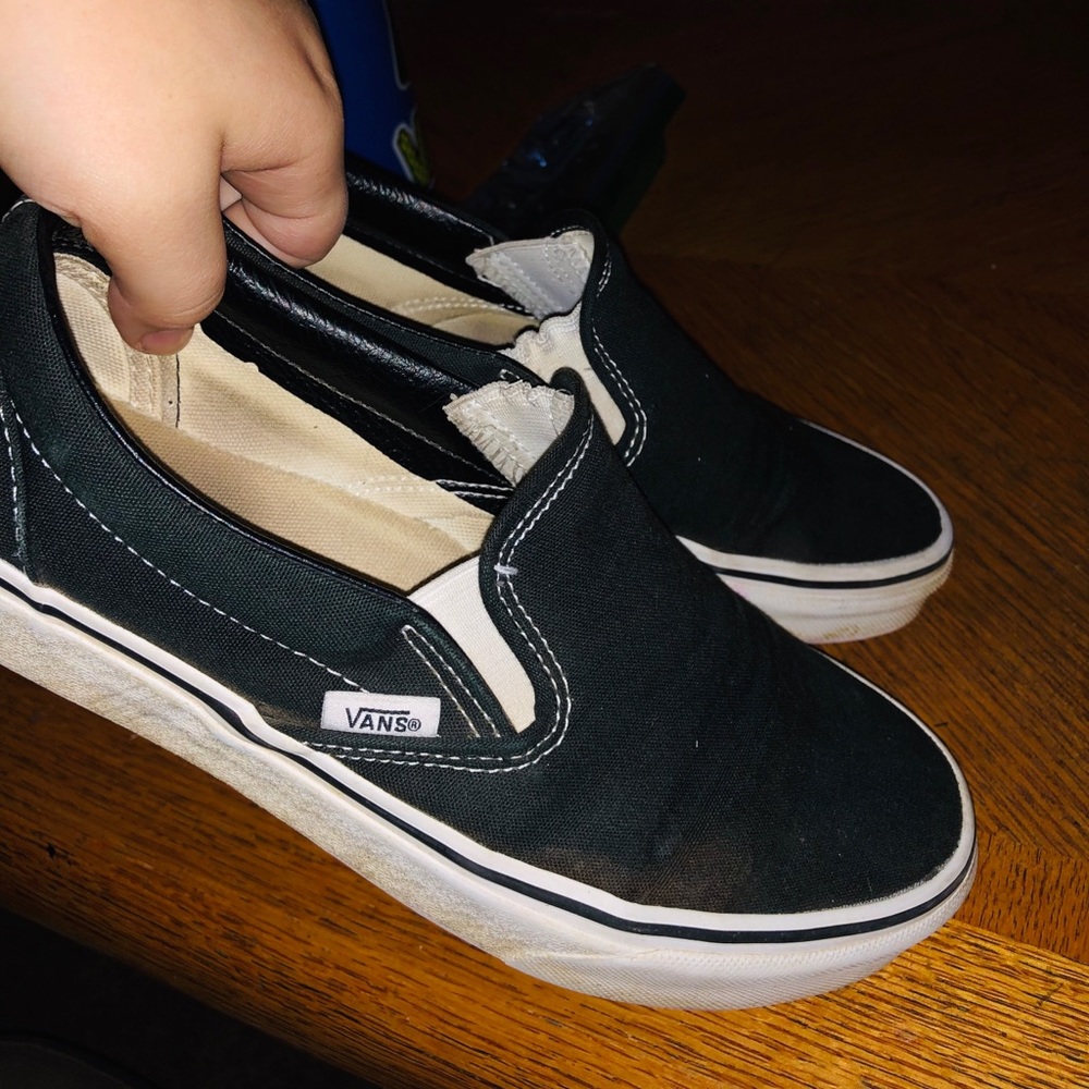 Black and white slip on Vans